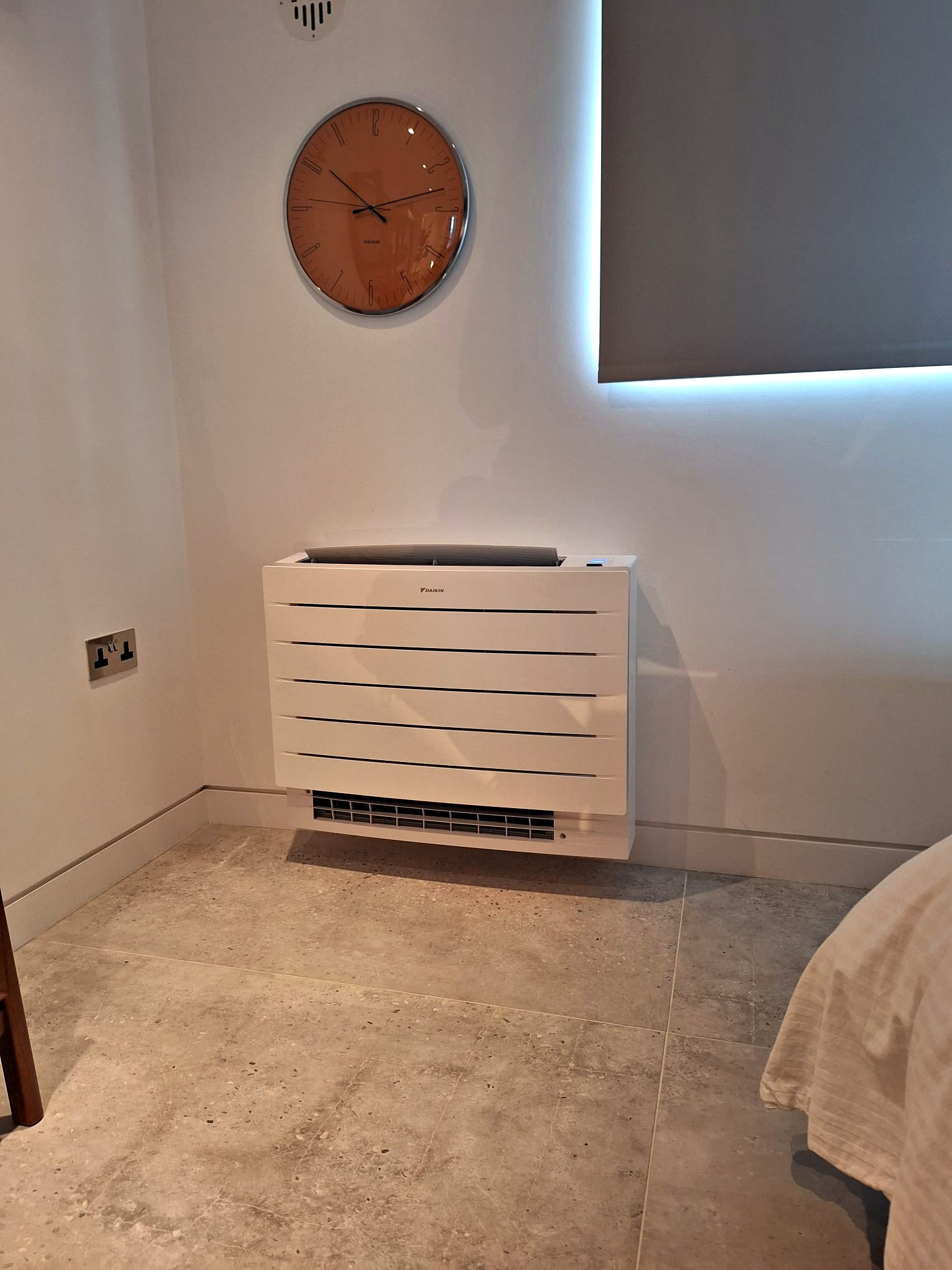 White floor standing console unit fitted in a bedroom