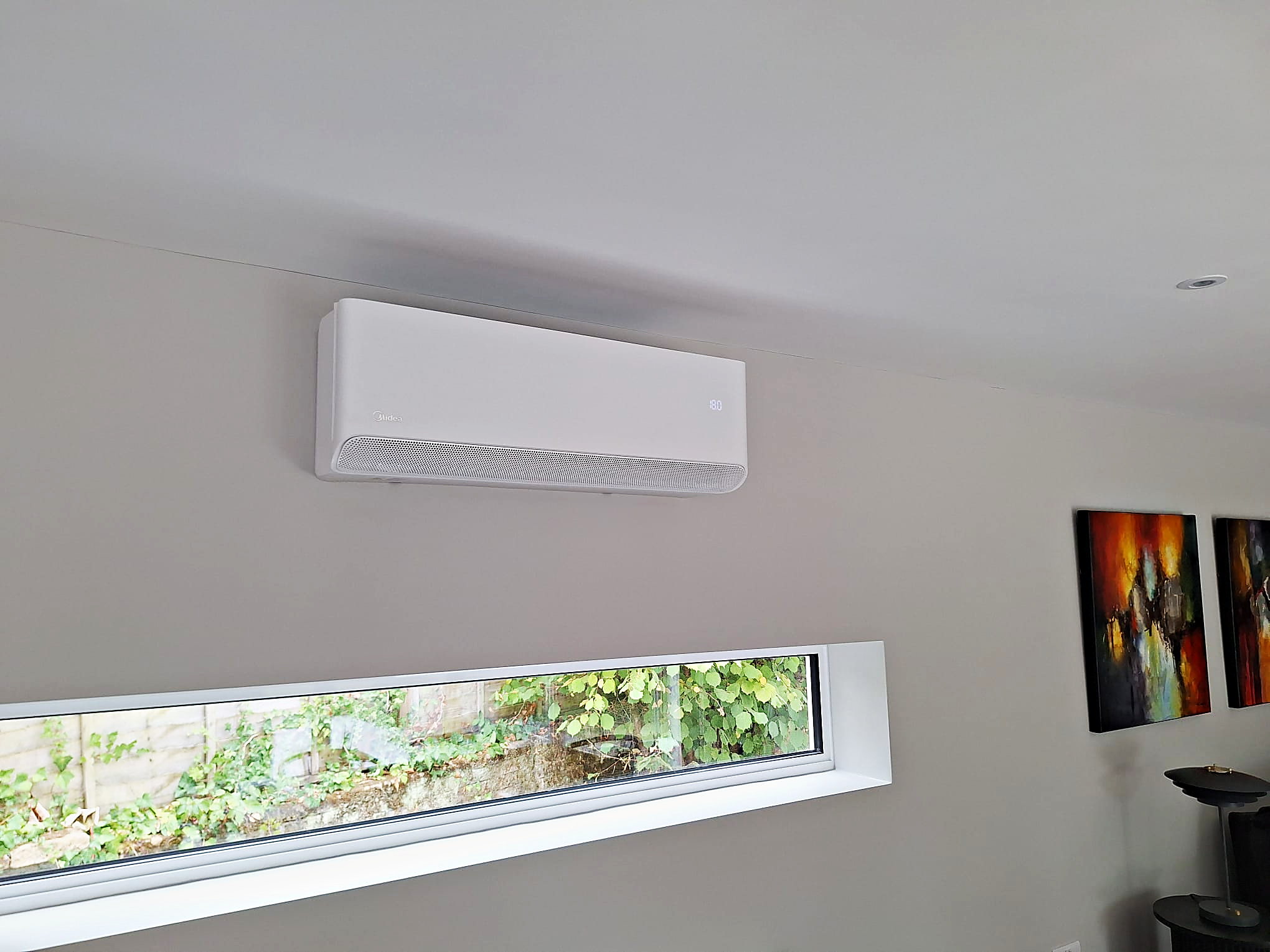 Wall mounted unit fitted high on the wall of a finished room